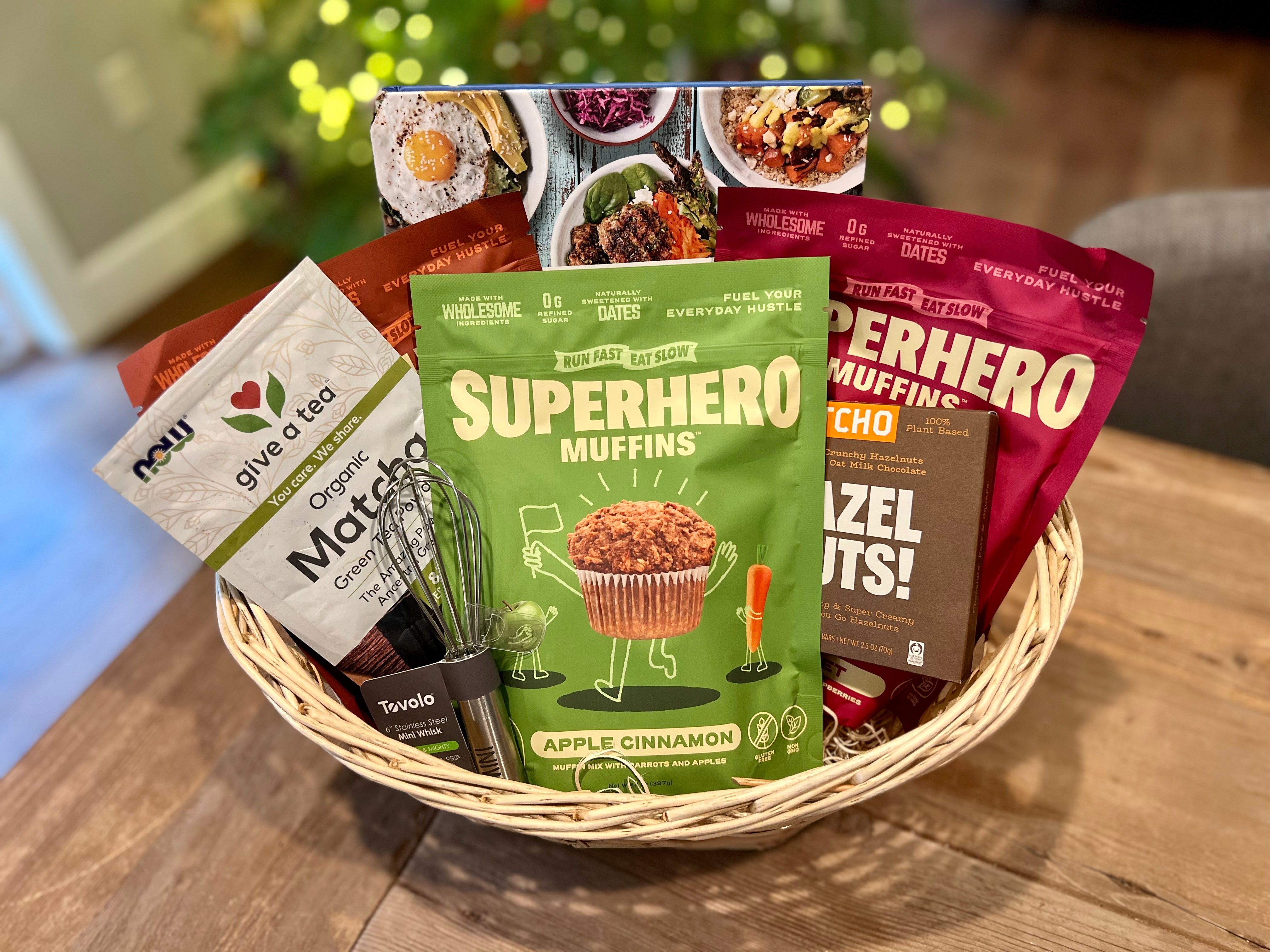 Superhero Variety Pack Mixes with a cookbook, matcha tea, and a whisk in a basket.
