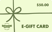Mint green e-gift card with leaf green bow wrapped around it, leaf green value of $50 in the top right, leaf green Superhero Muffins seal logo in the bottom left, and leaf green E-GIFT CARD text in the bottom right.