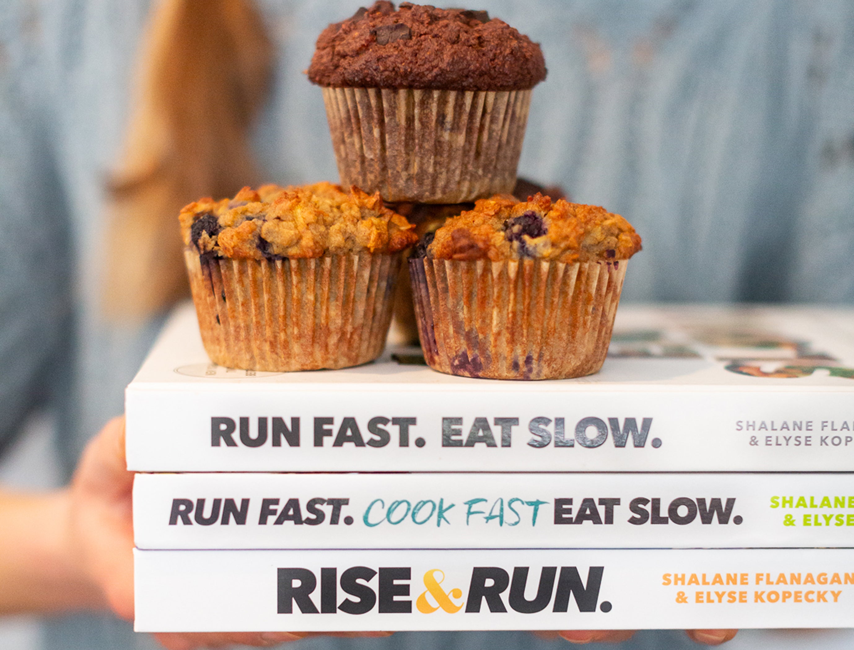 Superhero Muffins on top of three bestselling books by Run Fast. Eat Slow.