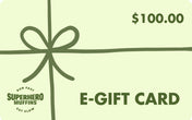 Mint green e-gift card with leaf green bow wrapped around it, leaf green value of $100 in the top right, leaf green Superhero Muffins seal logo in the bottom left, and leaf green E-GIFT CARD text in the bottom right.